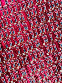 Assortment of frozen food products arranged artistically on a bright red background.