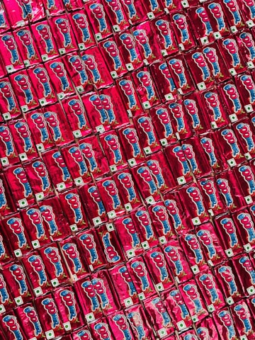 Assortment of frozen food products arranged artistically on a bright red background.