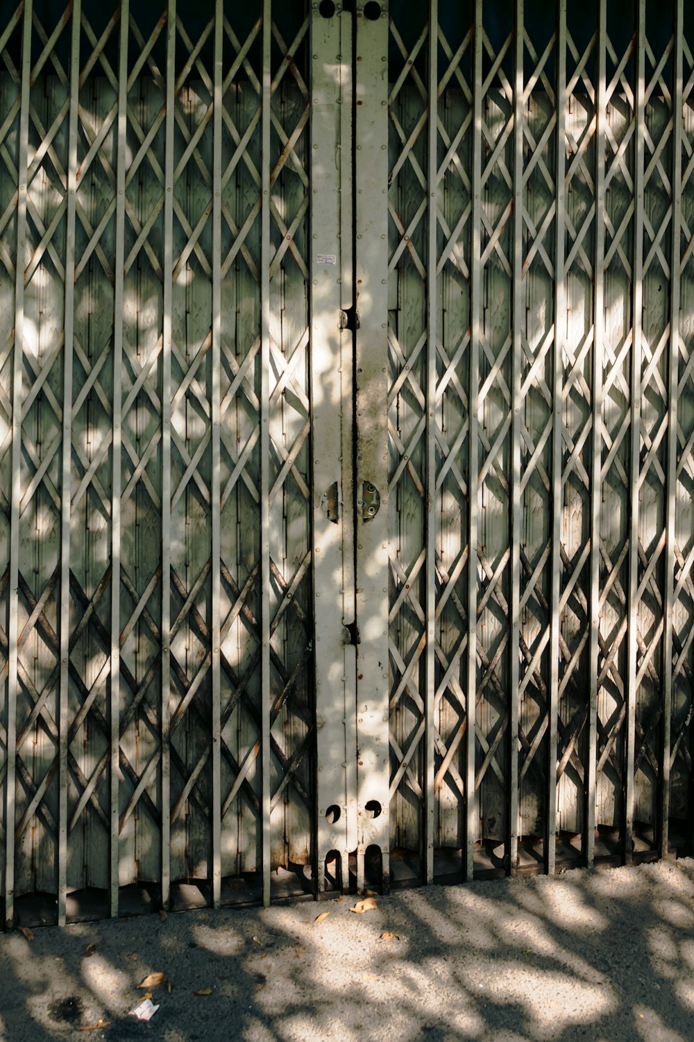 a metal gate with a stop sign on it