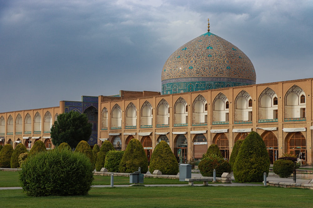 a large building with a green dome on top of it