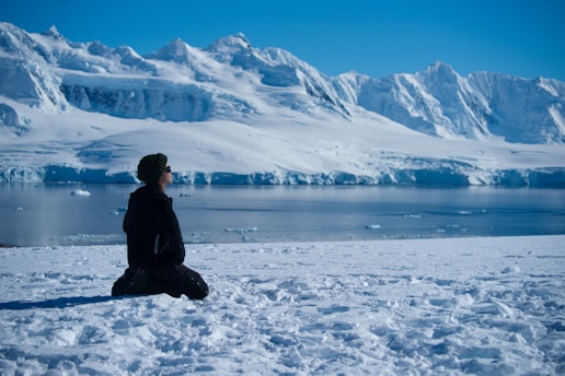 sitting in Antarctica during a expedition planned by Francesco Margaretini Luxury Travels