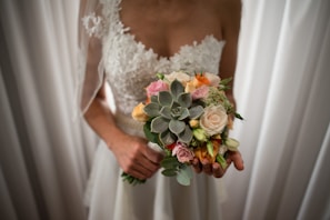 A vibrant bridal bouquet featuring a mix of seasonal blooms.