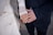 a close up of two people holding hands