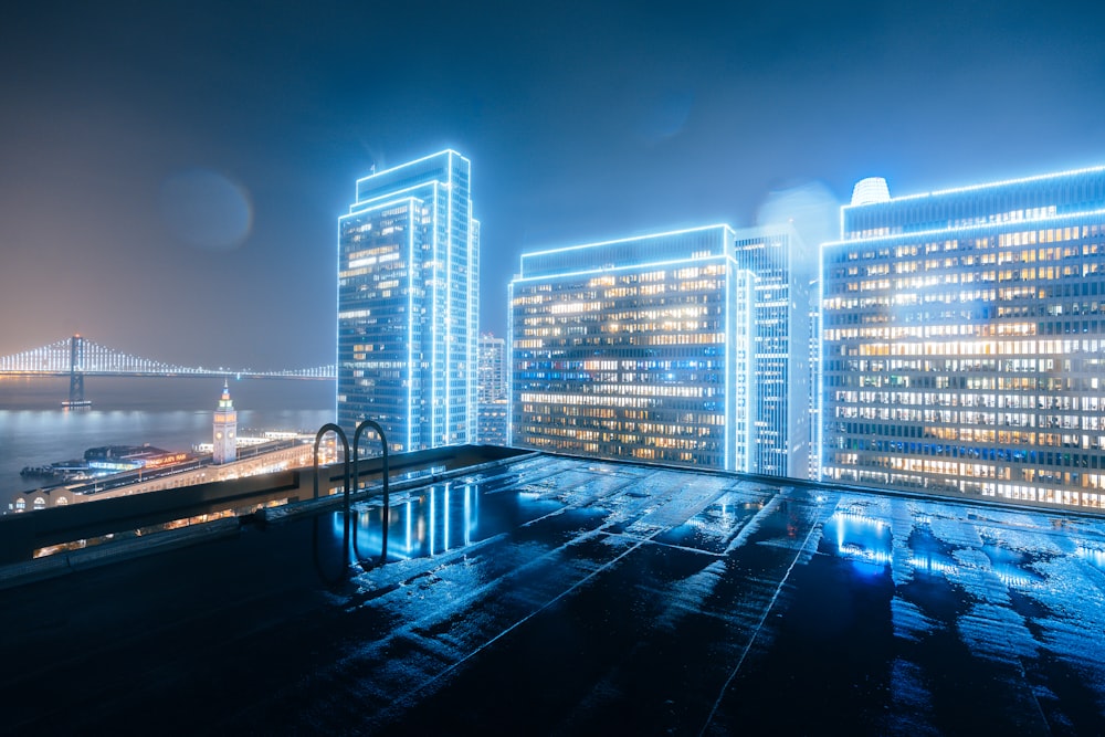 a view of a city at night from a rooftop