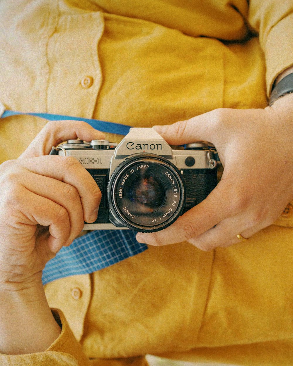 a person holding a camera in their hands