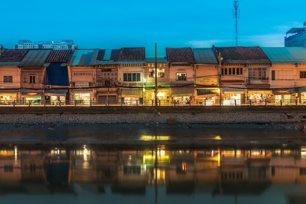 The charming Quai des Bateliers outside la 5ème avenue, with warm light spilling from the boutique windows at dusk.