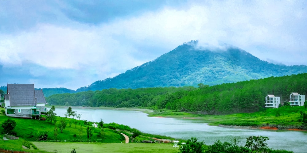 a house on a hill overlooking a body of water