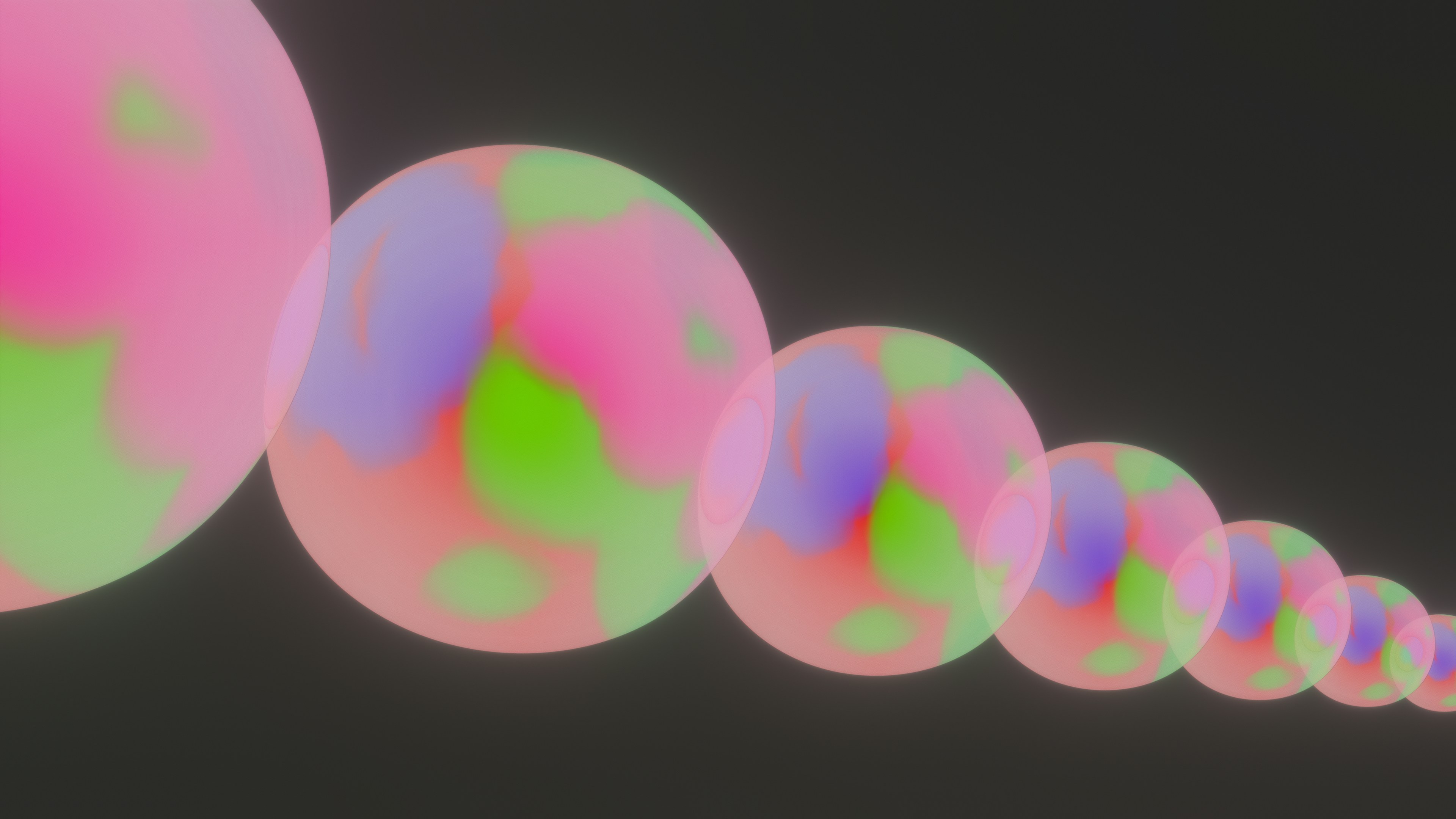 a line of colorful balls on a black background