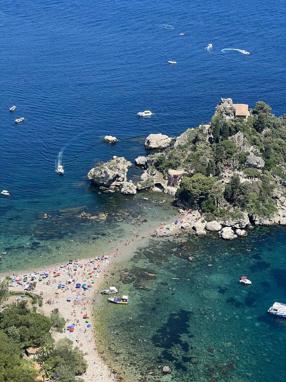 a group of boats floating on top of a body of water