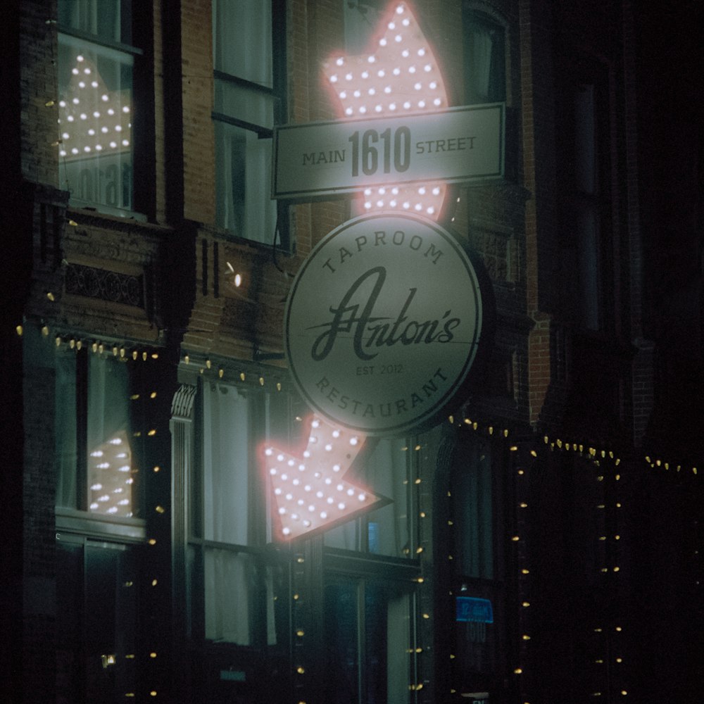 a neon sign on the side of a building