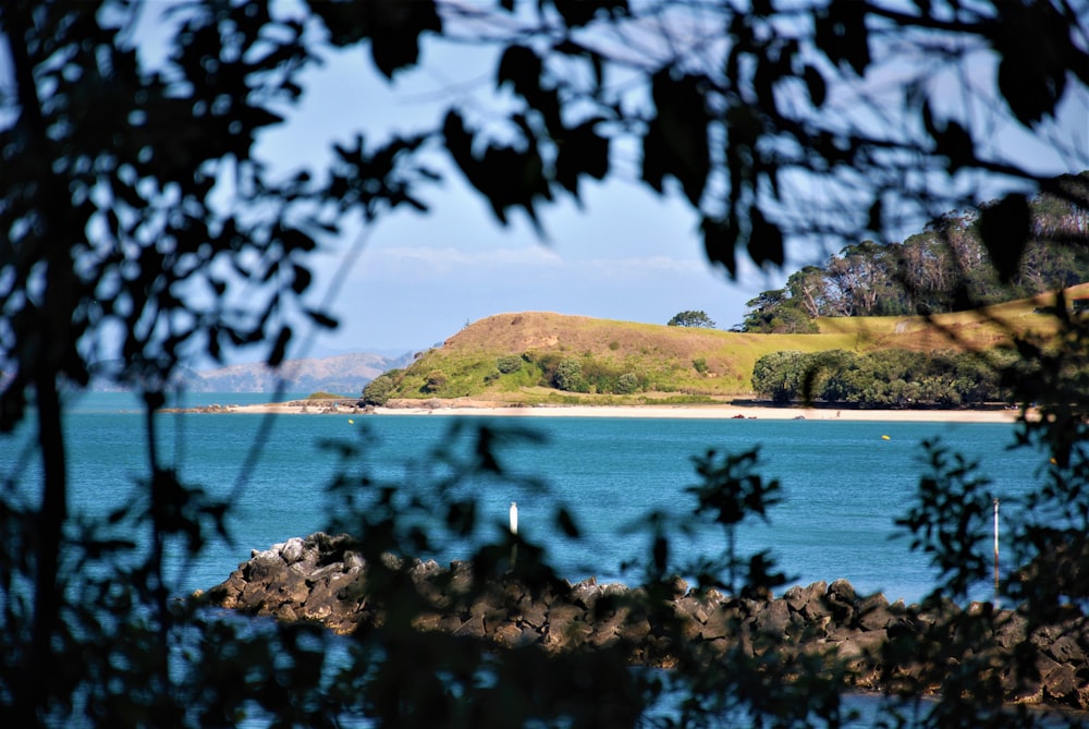 a body of water with a small island in the distance