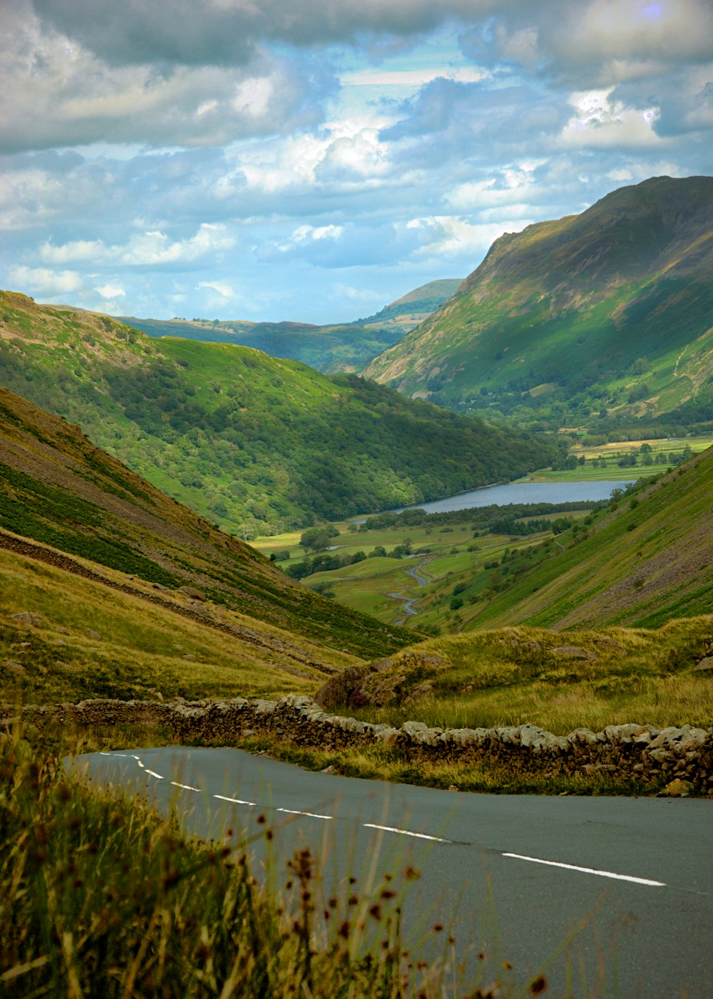 a view of a winding road in the mountains