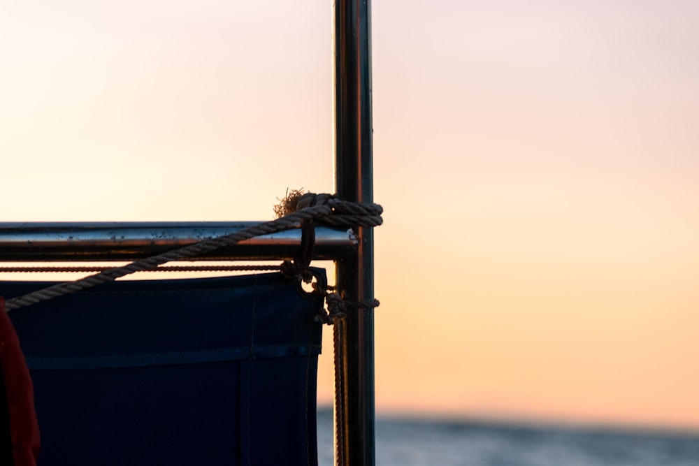 a chair sitting on top of a beach next to the ocean