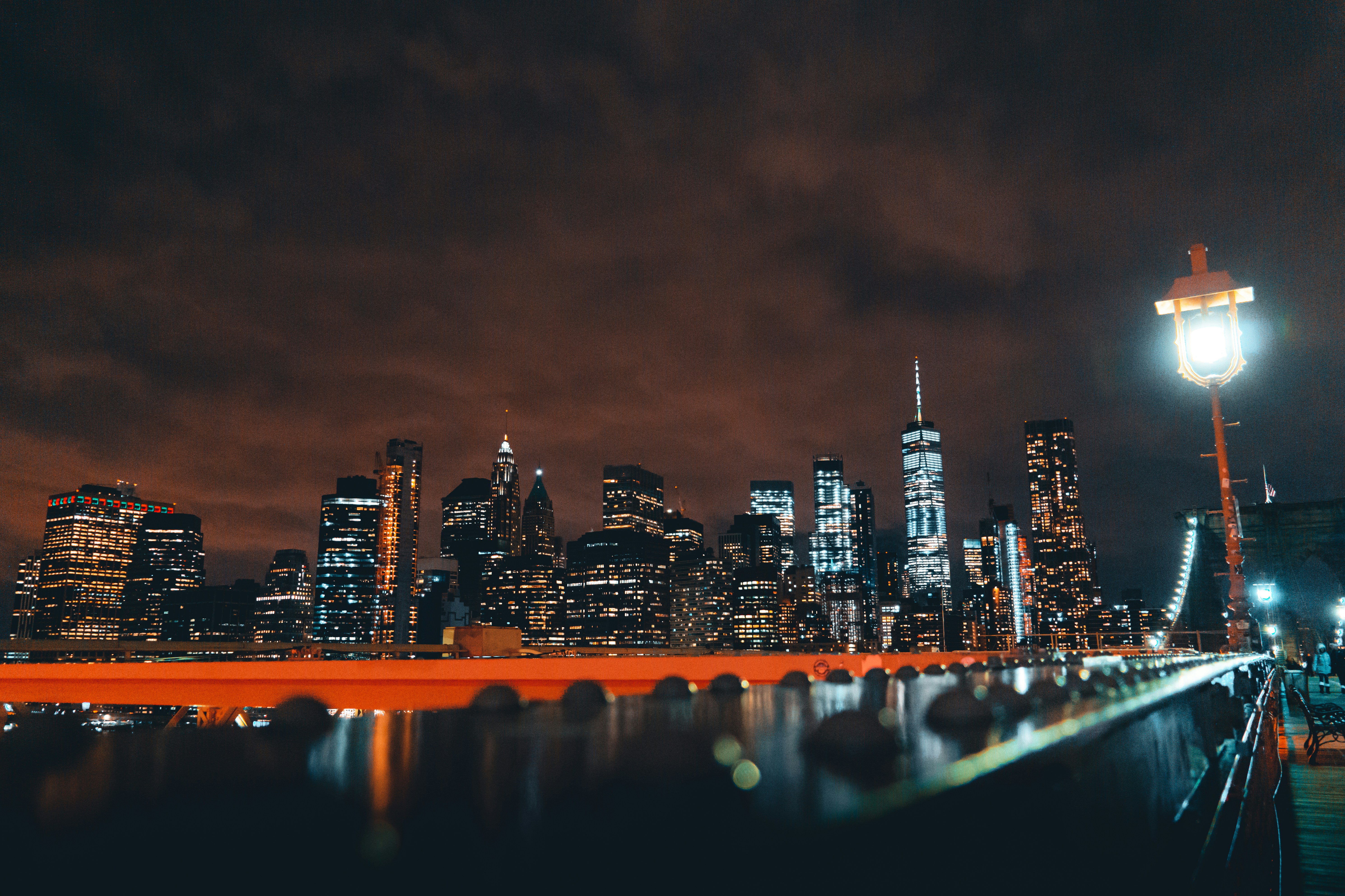 a view of a city at night from a pier
