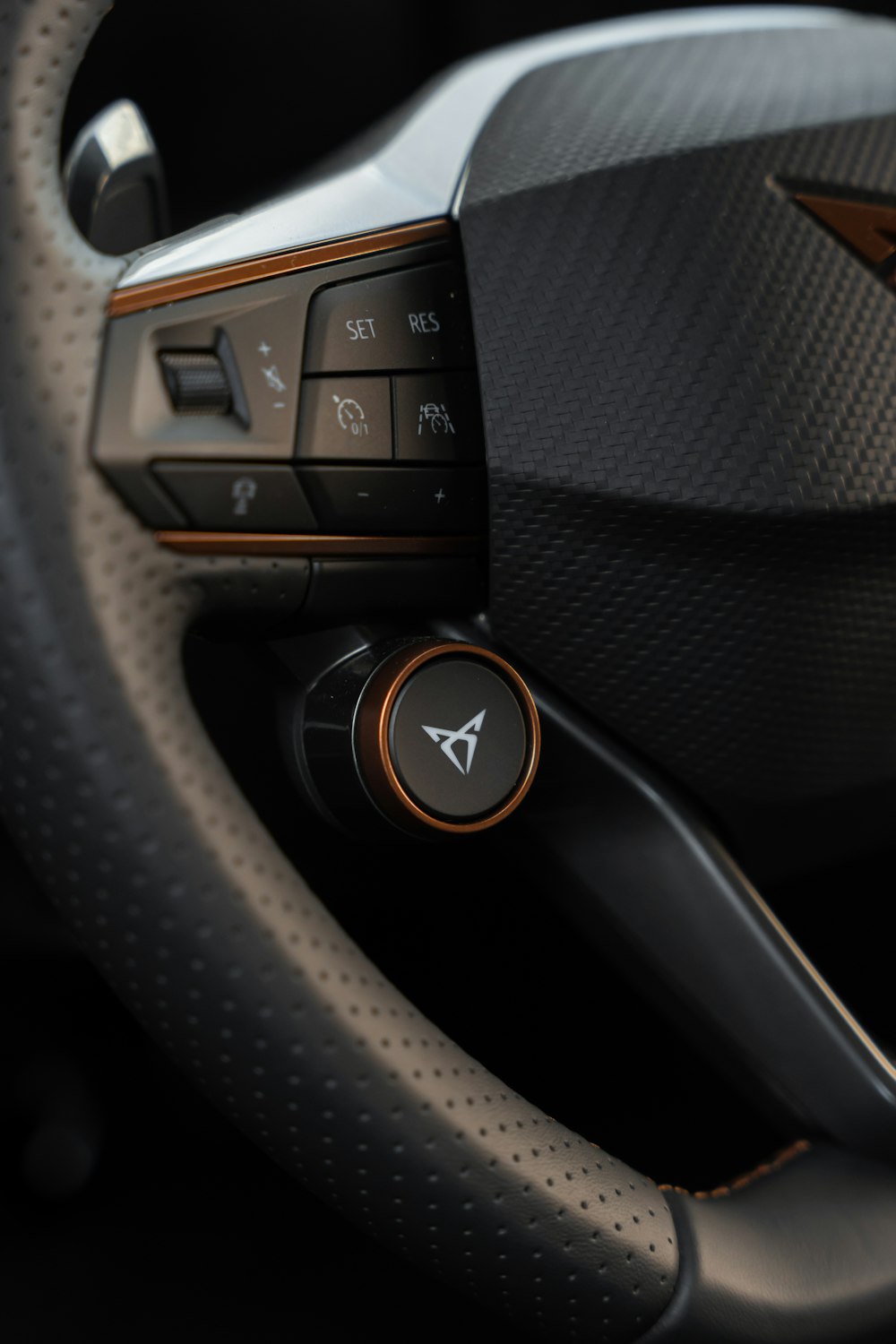 a close up of a steering wheel in a car