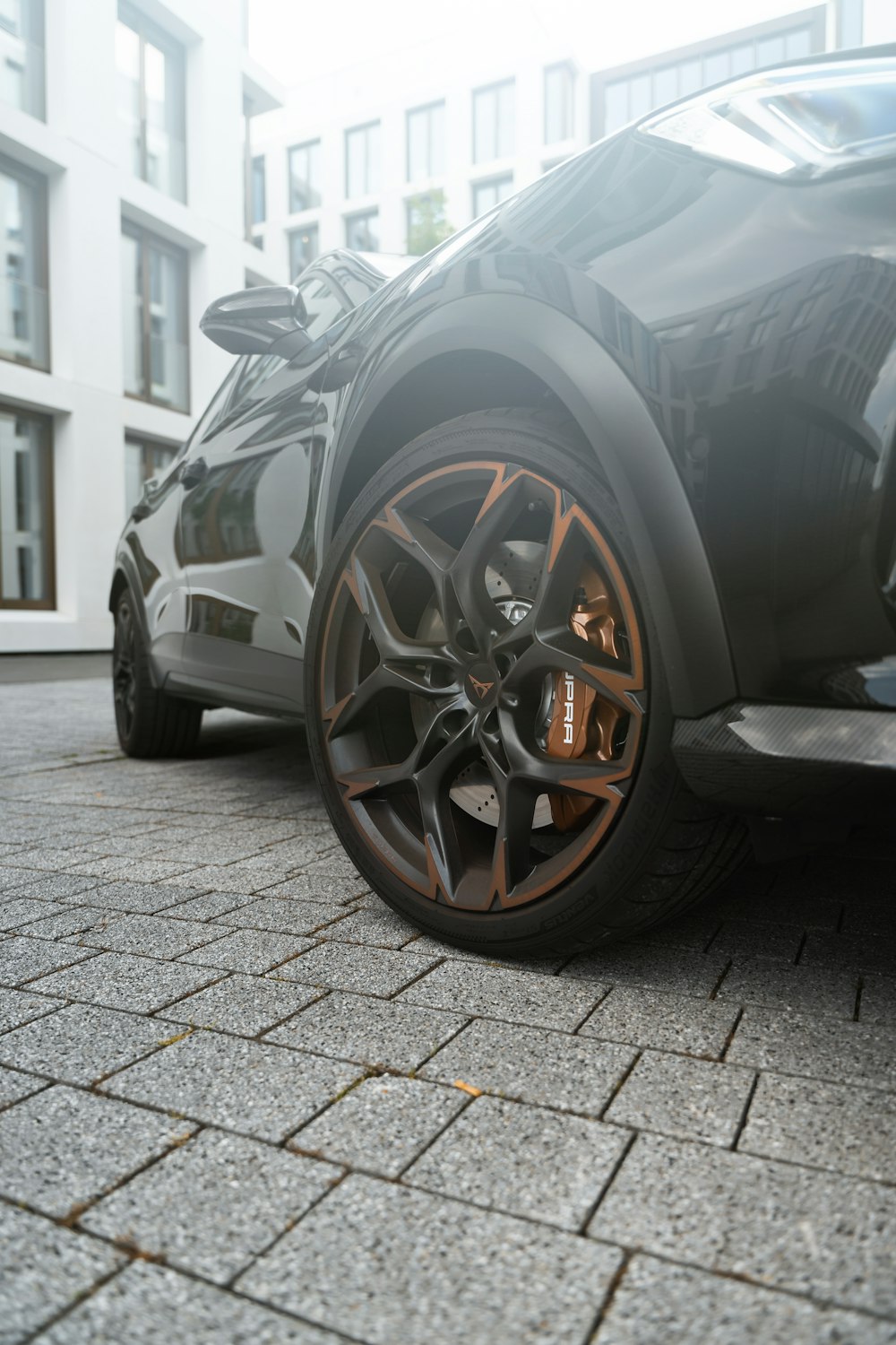 a close up of a car parked on a street