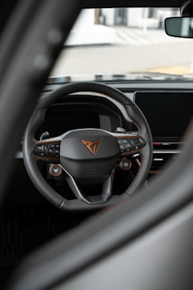 An elegant steering wheel with a modern aesthetic and bright colors.