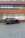 A sleek black SUV parked in front of a modern building.