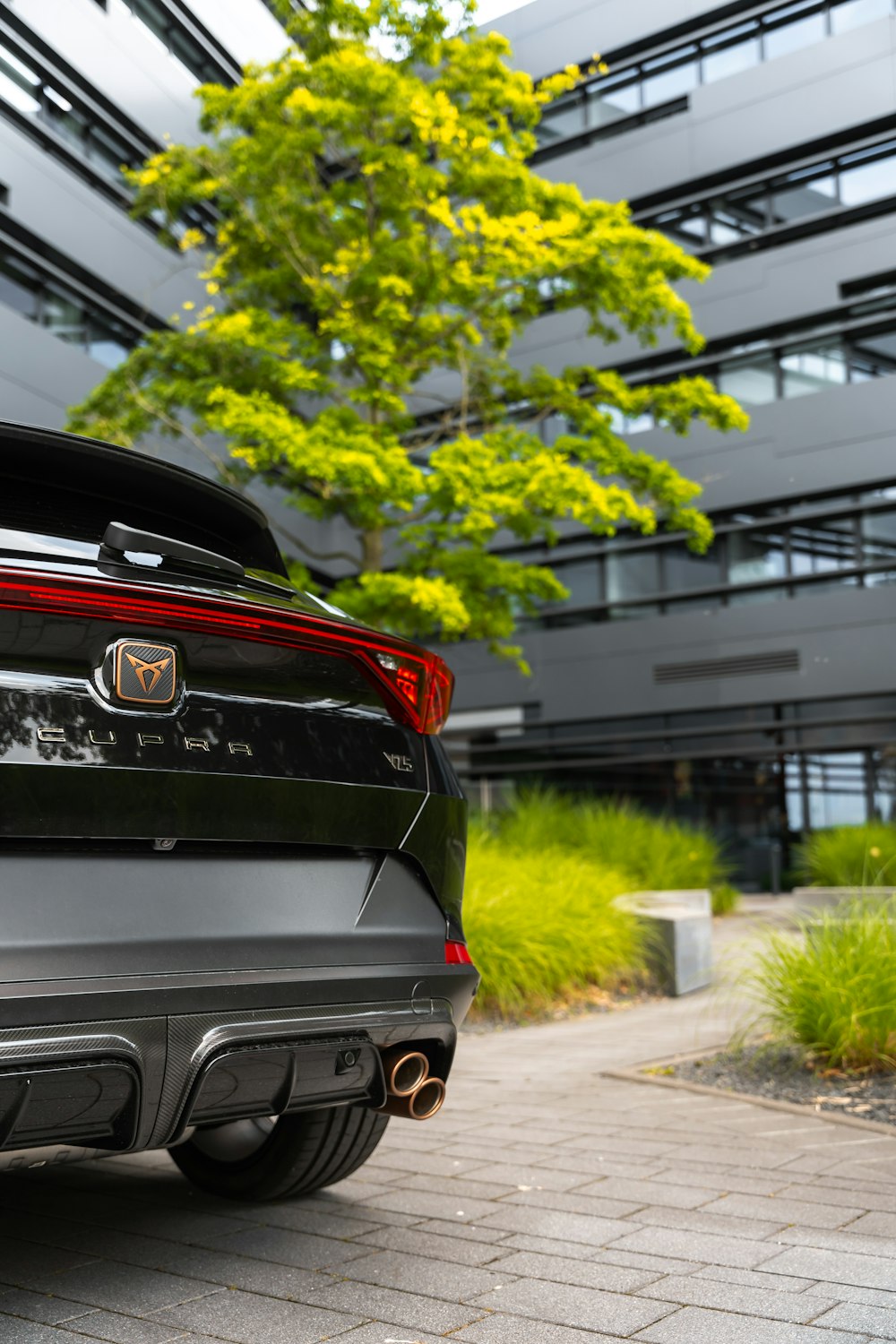 a black car parked in front of a building