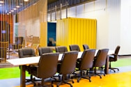 a long table with a bunch of chairs around it