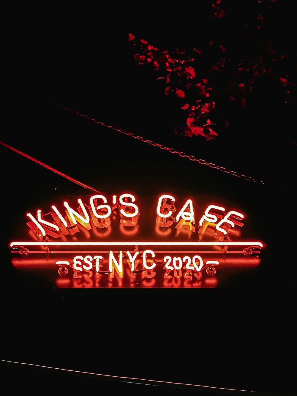 a neon sign that reads king's cafe