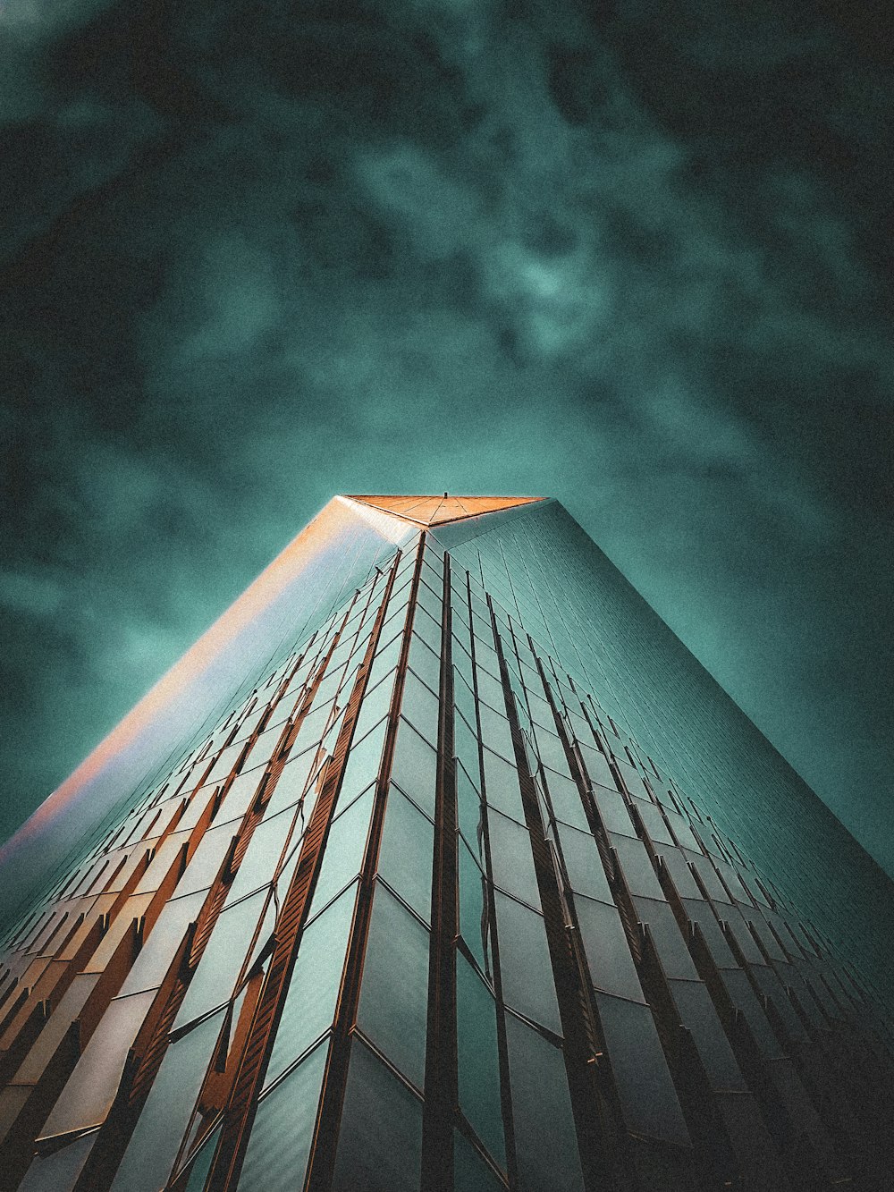 a tall building with a sky background