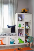 a child's room with a bookcase and toys