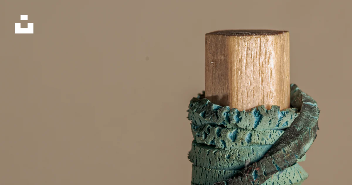 A close up of a wooden stick with a string wrapped around it photo ...