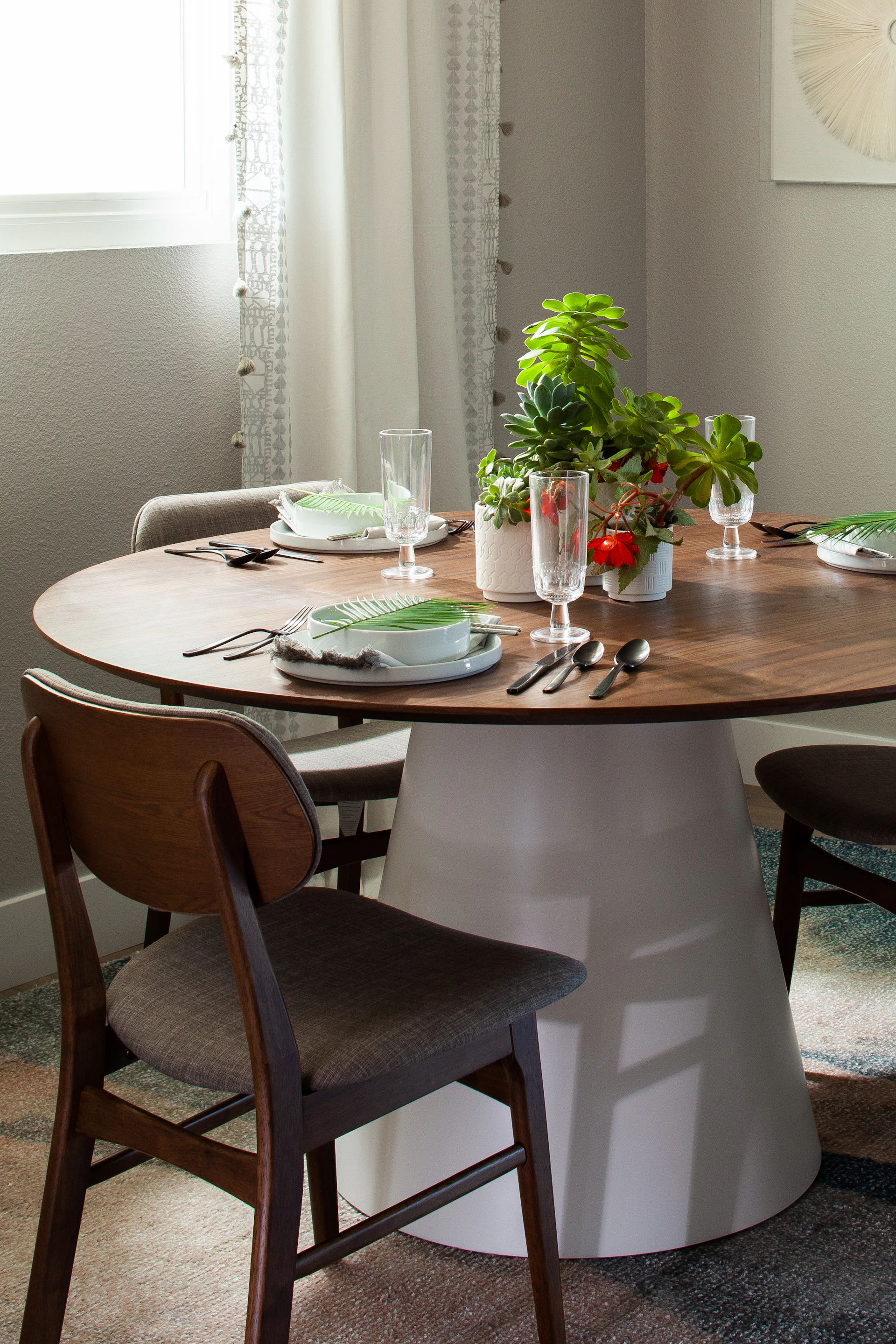 An inviting dining setup showcasing a mix of classic and contemporary chairs around a sturdy, elegant table.