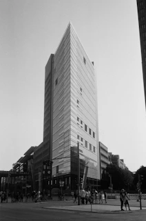 A modern German cityscape featuring clean architecture and a bustling street scene