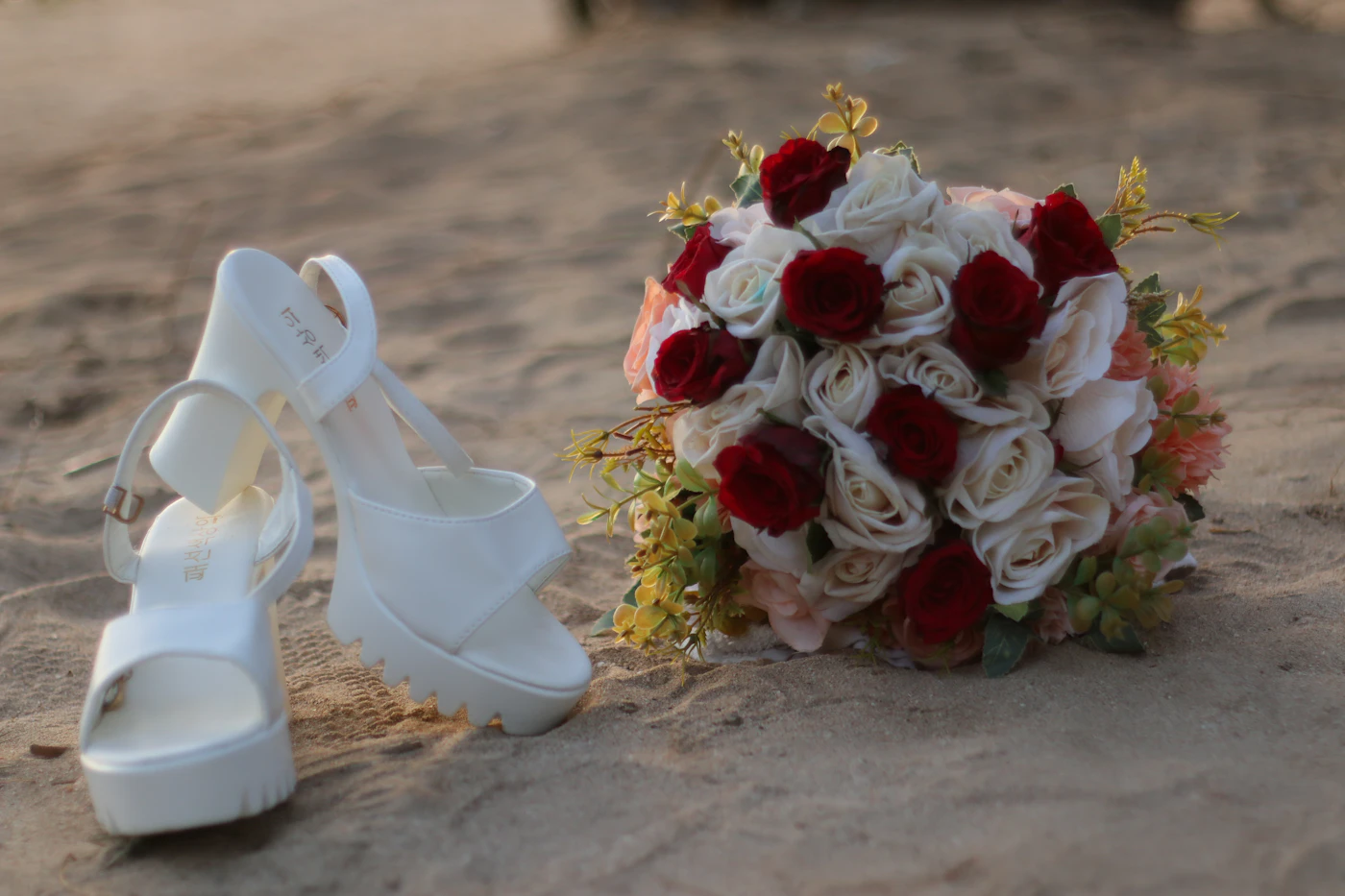 Bridal closet essentials for destination weddings — A bride carefully packing her wedding dress into a garment bag for air travel.