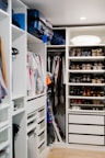 Wardrobe and storage space neatly arranged in a shared room.