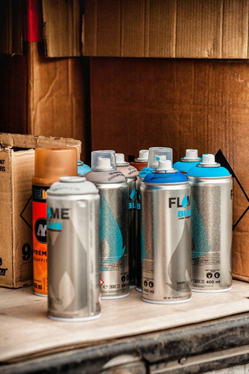 a group of cans sitting on top of a wooden table