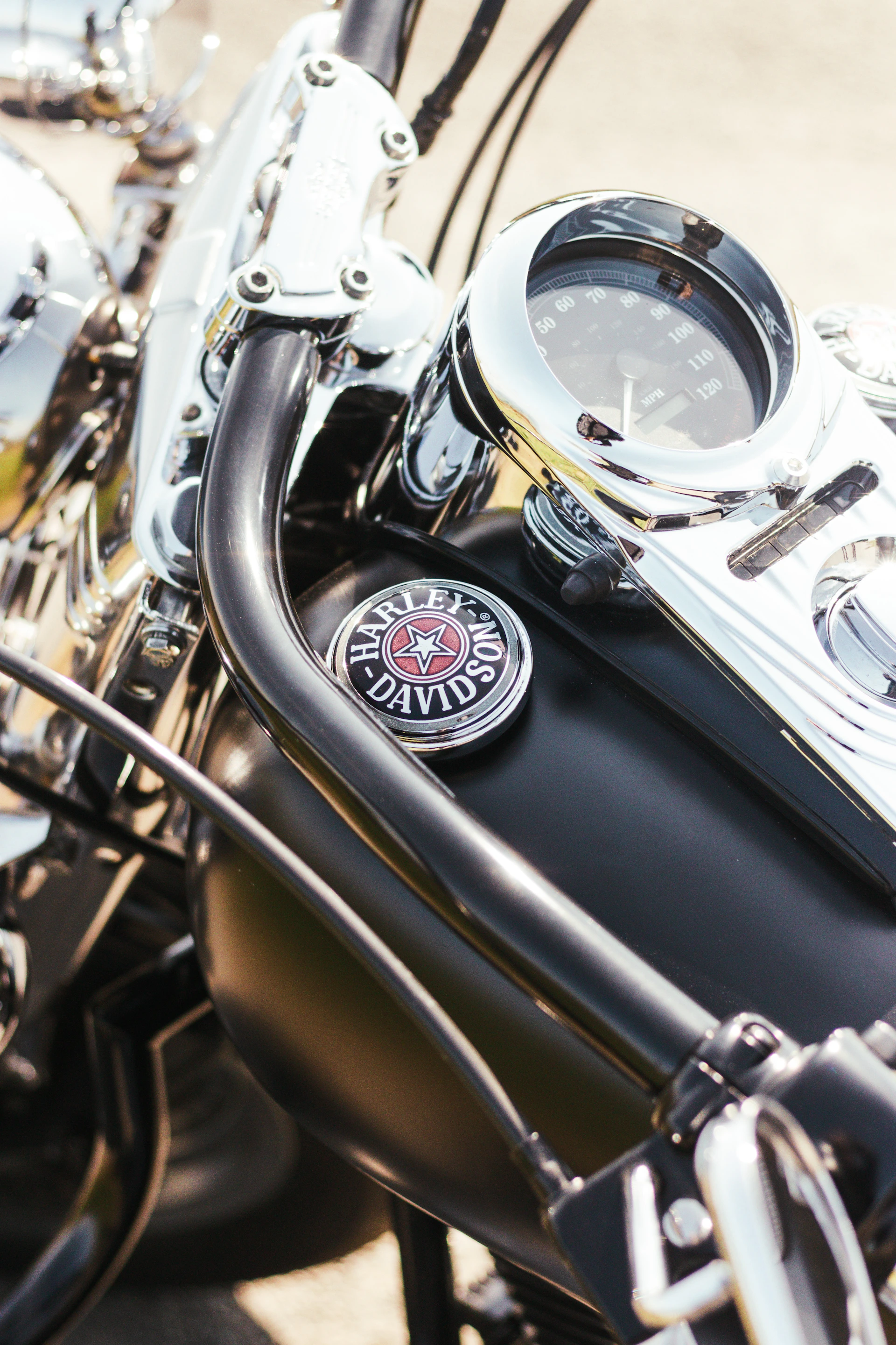 Close-up of a Yamaha bike’s dashboard and handlebars, highlighting quality and craftsmanship under natural sunlight.