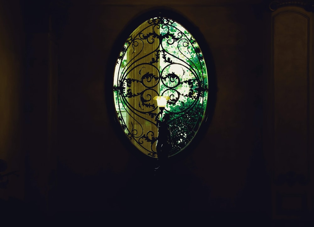 a circular window with a wrought iron design