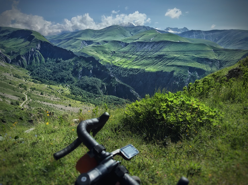 a bike is parked on the side of a hill