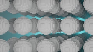 A series of gray pixelated spheres are arranged in a symmetrical pattern against a teal background, creating a sense of depth and repetition. The spheres have a blocky, voxel-like structure, resembling digital or abstract art.