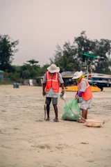 a couple of people that are standing in the sand