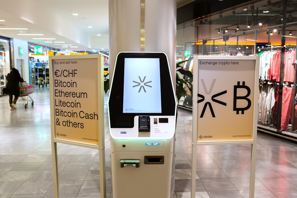 a display in a store with a bitcoin machine in front of it