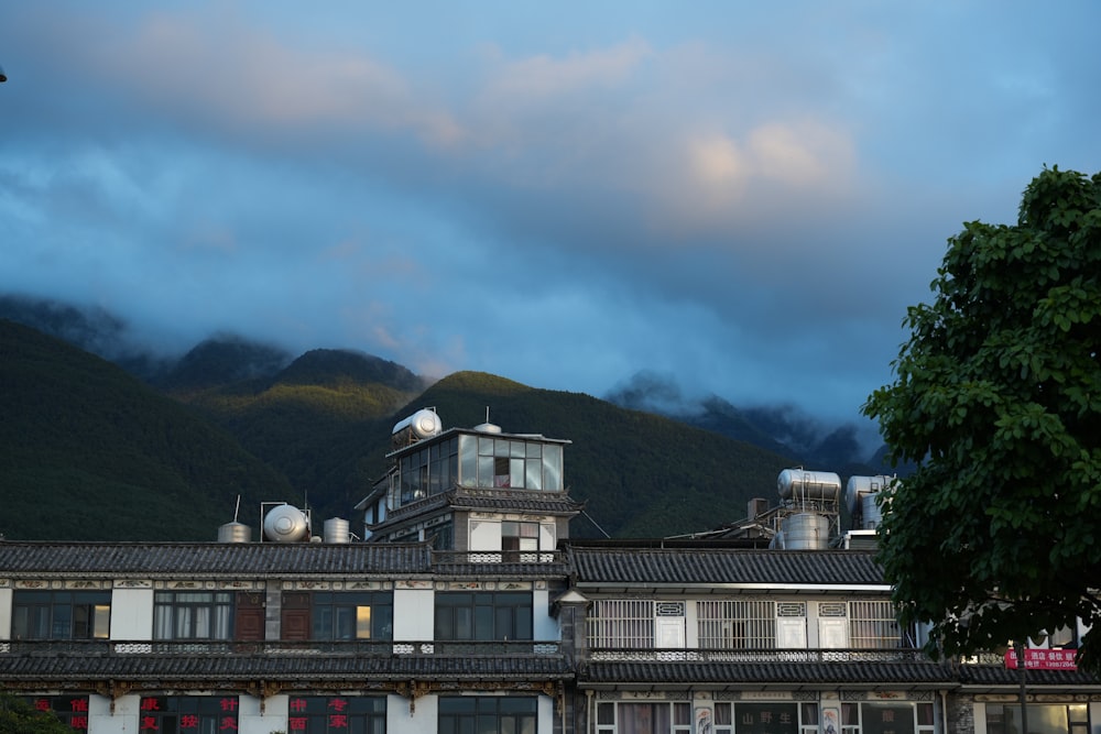 a building with a mountain in the background