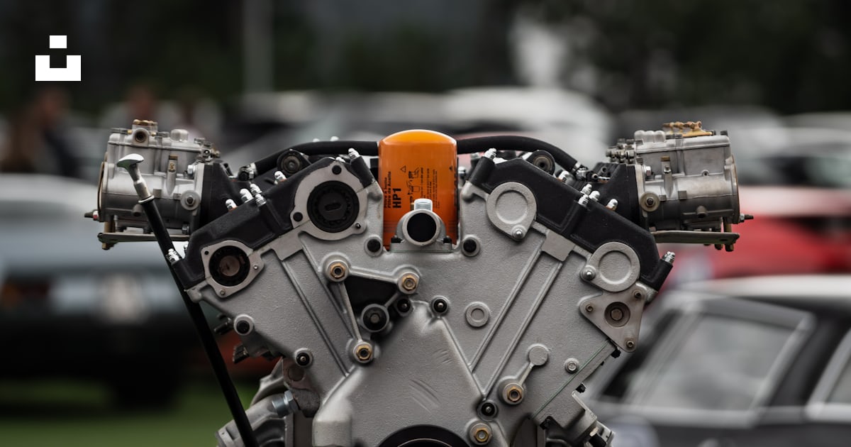 A close up of an engine on a car photo – Free Engine Image on Unsplash