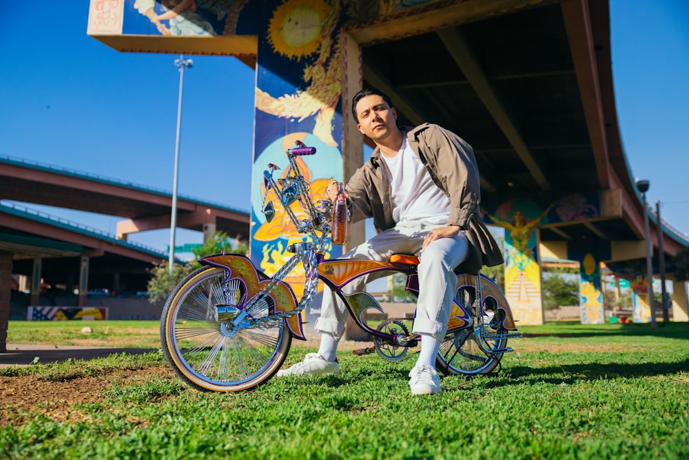 a man sitting on a bike in front of a building