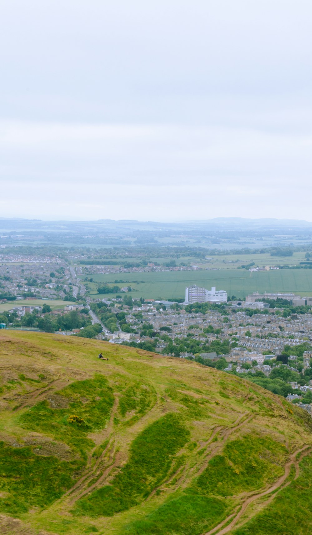 a view of a city from the top of a hill