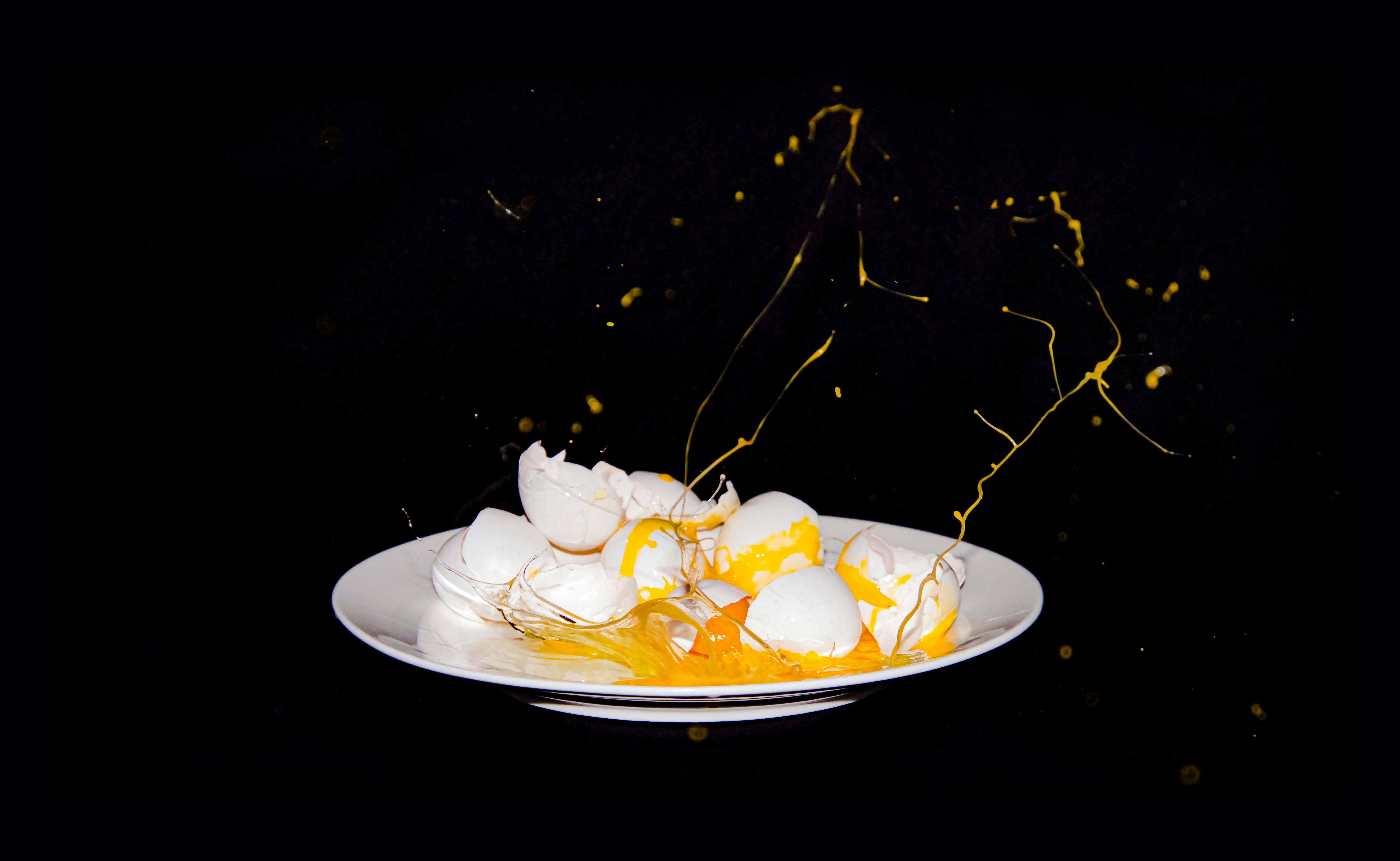 a plate of food on a black table