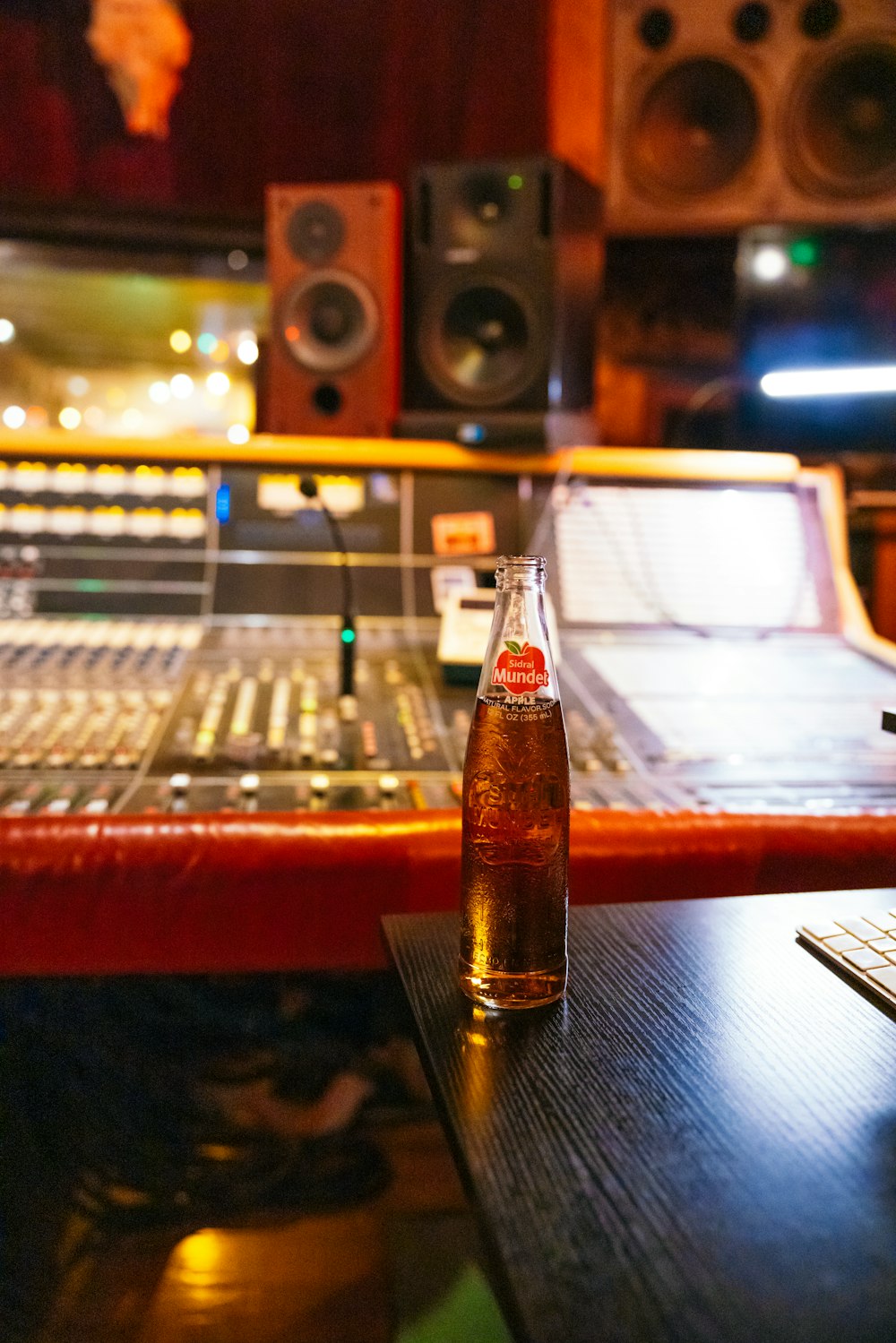 a bottle of soda sitting on top of a table