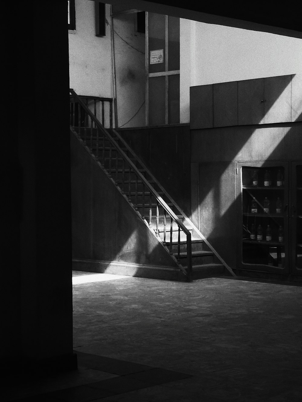 a black and white photo of a stairway in a building