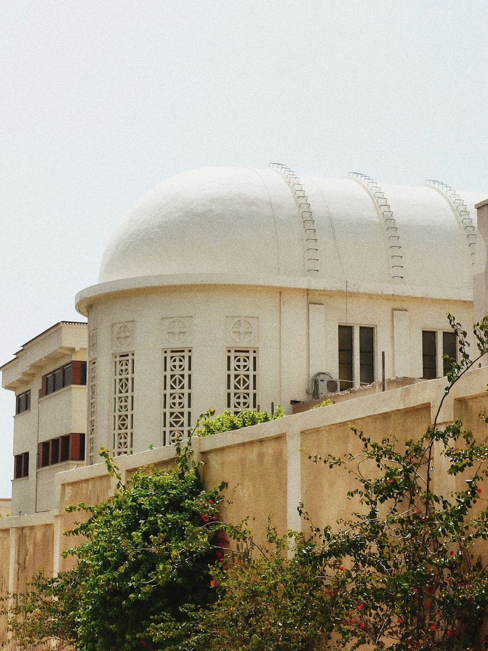 a white building with a large dome on top of it