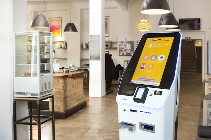 A person using a self-service payment kiosk, similar to the six self-service kiosks at the new Silverado DMV facility