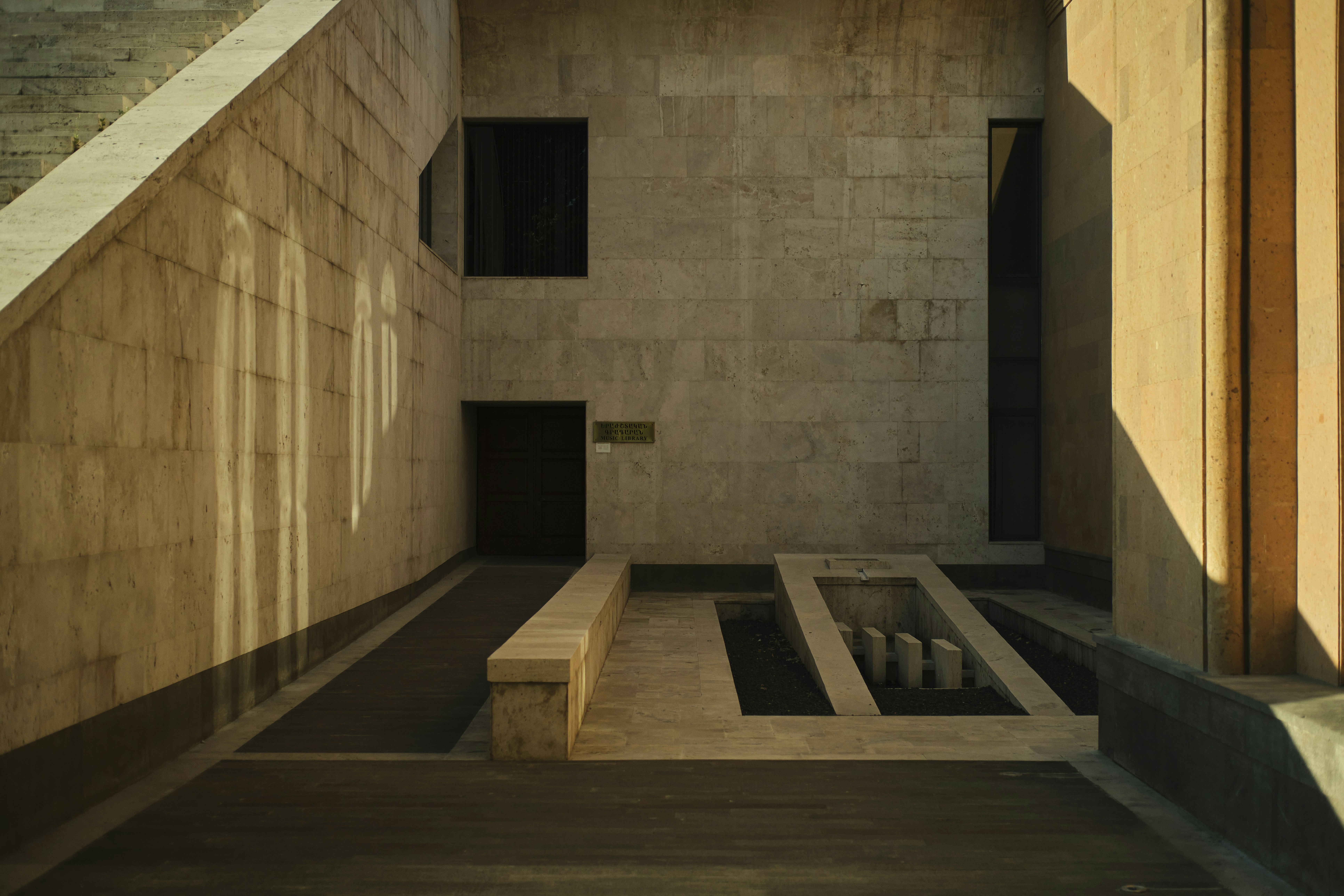 a room with a bench in the middle of it