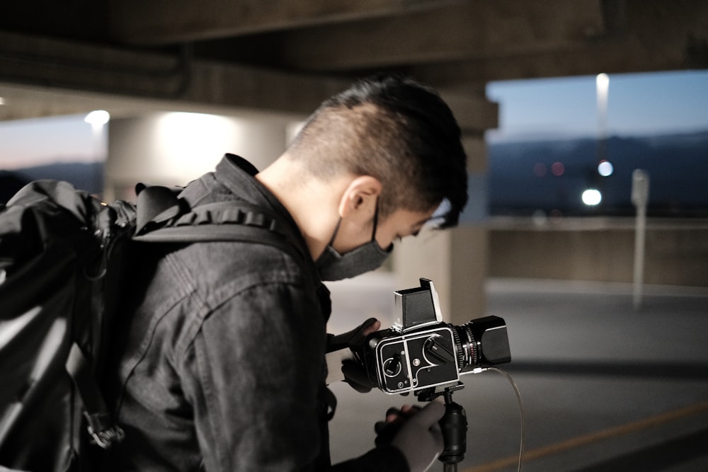 a man with a backpack and a camera